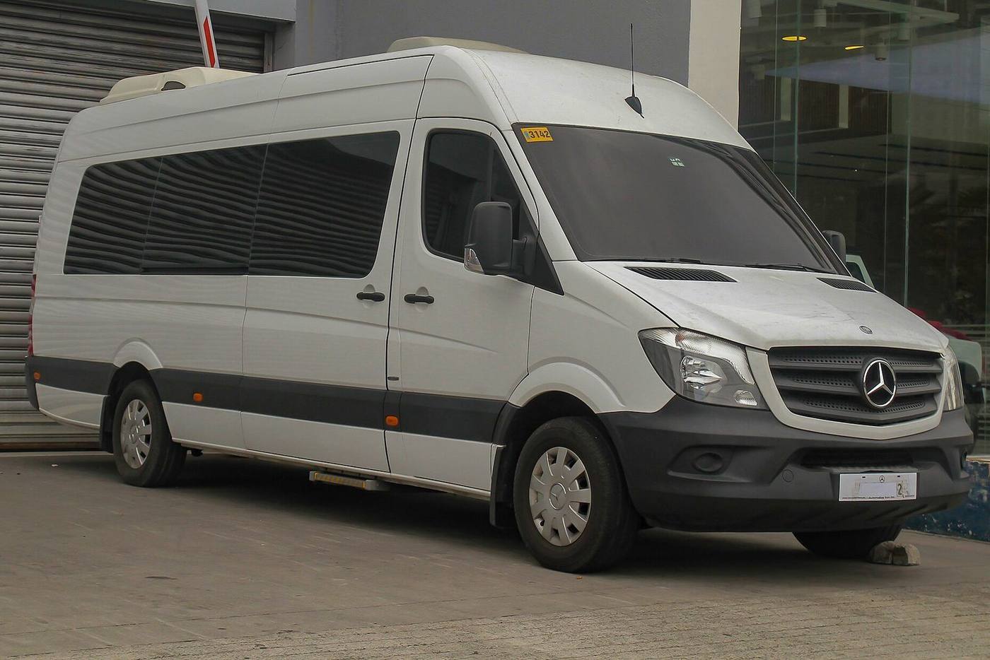 Modern 16-seat minibus ready for a private group transfer